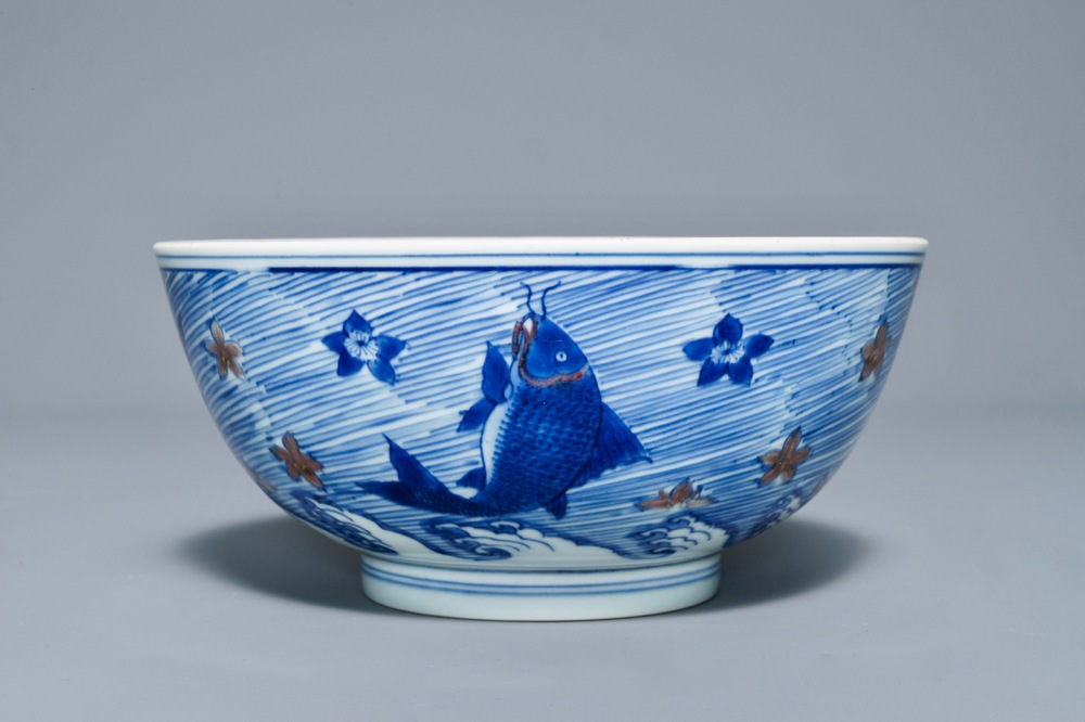 A rare Chinese blue and underglaze red bowl with carps and marine animals, Xuande mark, Kangxi